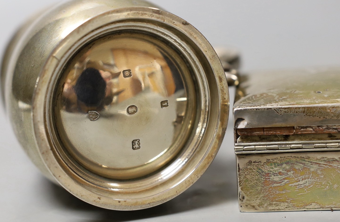 A George V silver christening mug, London, 1934, 95mm and a silver mounted cigarette box.